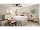 Bedroom features wood-look floors, a ceiling fan, and is fully furnished with a Queen bed at 4953 Apple Valley Rd, Douglasville, GA 30135