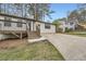 Charming single Gathering home boasts a cozy front porch and driveway in a suburban setting at 4953 Apple Valley Rd, Douglasville, GA 30135