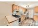 Classic kitchen with stainless steel appliances, wood cabinets and updated countertops at 4953 Apple Valley Rd, Douglasville, GA 30135