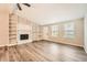 Cozy living room features a fireplace with built-in shelving and hardwood flooring at 4953 Apple Valley Rd, Douglasville, GA 30135