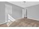 Bedroom featuring tan carpet, light gray walls, white trim, and white doors at 520 Crick Pt, Palmetto, GA 30268