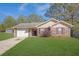 Charming single-story brick home with a well-manicured lawn and attached two-car garage at 520 Crick Pt, Palmetto, GA 30268