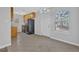 Bright kitchen space with views from dining nook, showcasing tile flooring and light wood cabinetry at 520 Crick Pt, Palmetto, GA 30268