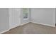 Cozy dining nook featuring ceramic tile flooring, a window view, and a nearby entry door at 520 Crick Pt, Palmetto, GA 30268