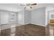 Combined living and dining area showcasing tile flooring, a modern chandelier, and access to the bathroom at 520 Crick Pt, Palmetto, GA 30268