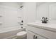 Clean bathroom featuring a shower-tub combo with black fixtures and a white vanity at 101 Priestwood Ln, Acworth, GA 30102