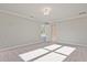 Spacious carpeted bedroom with natural light and a view of the landscaped yard at 101 Priestwood Ln, Acworth, GA 30102