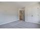 Bedroom featuring neutral paint and carpet, and a walk-in closet at 101 Priestwood Ln, Acworth, GA 30102
