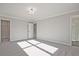 Neutral bedroom with gray carpet, white walls, and an ensuite bath and closet at 101 Priestwood Ln, Acworth, GA 30102