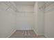Walk-in closet with shelving, neutral paint, and carpet at 101 Priestwood Ln, Acworth, GA 30102