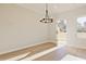Dining room featuring a modern chandelier and outdoor access to backyard at 101 Priestwood Ln, Acworth, GA 30102