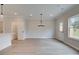 Spacious dining area featuring light-colored wood-look flooring and a modern chandelier at 101 Priestwood Ln, Acworth, GA 30102