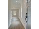 View of entryway with wood-look floors and a long hallway at 101 Priestwood Ln, Acworth, GA 30102