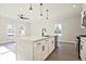 Kitchen with stainless steel appliances, white cabinetry, an island and modern pendant lighting at 101 Priestwood Ln, Acworth, GA 30102