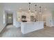 Modern kitchen with stainless steel appliances, white cabinets, and large kitchen island at 101 Priestwood Ln, Acworth, GA 30102