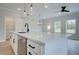 Modern kitchen island featuring a large countertop, sleek hardware and stainless steel appliances at 101 Priestwood Ln, Acworth, GA 30102