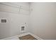 Bright laundry room includes washer and dryer hookups and a wire shelf for added storage at 101 Priestwood Ln, Acworth, GA 30102