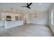 Open-concept living and kitchen area, featuring modern appliances and wood-look floors at 101 Priestwood Ln, Acworth, GA 30102