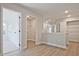 Hallway featuring several doorways, luxury vinyl flooring and several storage opportunities at 101 Priestwood Ln, Acworth, GA 30102
