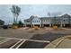 Street view of new townhome construction, featuring attached garages and modern architecture at 101 Priestwood Ln, Acworth, GA 30102
