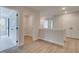 Upstairs landing featuring a laundry room and open doorways at 101 Priestwood Ln, Acworth, GA 30102
