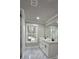 Bathroom featuring a double sink vanity with black hardware, a glass shower, and a view from the window at 355 Hilltop Cir Sw Ext, Mableton, GA 30126