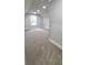 Bright bedroom with a window letting in natural light and neutral carpeting at 355 Hilltop Cir Sw Ext, Mableton, GA 30126