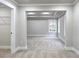 Spacious bedroom with tray ceiling, neutral walls, carpet, and walk-in closet at 355 Hilltop Cir Sw Ext, Mableton, GA 30126