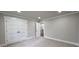 A bedroom with light grey walls, white trim, neutral carpet and a closet at 355 Hilltop Cir Sw Ext, Mableton, GA 30126