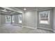 Bedroom features tray ceiling, neutral paint, bright windows, and neutral carpet at 355 Hilltop Cir Sw Ext, Mableton, GA 30126
