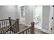 Hallway with wooden floors and a view of a bathroom with white cabinets at 355 Hilltop Cir Sw Ext, Mableton, GA 30126