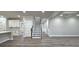Hallway with stairs and view of the kitchen at 355 Hilltop Cir Sw Ext, Mableton, GA 30126