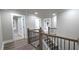 Open hallway with a staircase and multiple doors providing flexible design options at 355 Hilltop Cir Sw Ext, Mableton, GA 30126