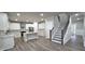 Open kitchen with island, stainless appliances and view of the staircase at 355 Hilltop Cir Sw Ext, Mableton, GA 30126