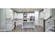 Modern kitchen featuring white cabinets, mosaic backsplash, and stainless steel appliances at 355 Hilltop Cir Sw Ext, Mableton, GA 30126
