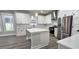 Modern kitchen featuring an island, stainless steel appliances, and white cabinets at 355 Hilltop Cir Sw Ext, Mableton, GA 30126