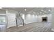 Spacious living room with staircase, fireplace and coffered ceiling, seamlessly connecting indoor spaces at 355 Hilltop Cir Sw Ext, Mableton, GA 30126