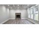 Well-lit living room with coffered ceilings, a brick fireplace, and large windows at 355 Hilltop Cir Sw Ext, Mableton, GA 30126