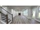Bright open living room featuring stairs, fireplace, and access to the outdoors at 355 Hilltop Cir Sw Ext, Mableton, GA 30126