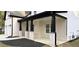 Covered porch with black columns, brick accents, and lush landscaping create inviting outdoor space at 355 Hilltop Cir Sw Ext, Mableton, GA 30126