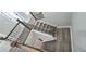 Classic staircase with hardwood steps, decorative iron balusters, and white risers at 355 Hilltop Cir Sw Ext, Mableton, GA 30126