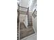 Elegant staircase with hardwood steps and white risers, adding a touch of class at 355 Hilltop Cir Sw Ext, Mableton, GA 30126