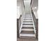 Staircase with white risers and dark treads at 355 Hilltop Cir Sw Ext, Mableton, GA 30126