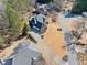 Aerial view of a brick home with a long driveway and manicured landscaping at 3795 Duckcove Way, Cumming, GA 30041