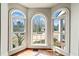 Bright and airy bay window with hardwood floors and a view of the landscaped yard at 3795 Duckcove Way, Cumming, GA 30041