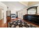 Bedroom features hardwood floors, fireplace, built in shelving and a large window for natural light at 3795 Duckcove Way, Cumming, GA 30041