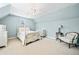 Light-filled bedroom featuring a charming bed frame, ceiling fan, and neutral carpet at 3795 Duckcove Way, Cumming, GA 30041