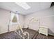 Minimal bedroom with a bed frame, carpet floor, and outside view at 3795 Duckcove Way, Cumming, GA 30041