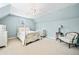 Bedroom with light blue walls, carpet, and antique-style furniture at 3795 Duckcove Way, Cumming, GA 30041