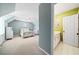 Bright bedroom leading into a bathroom with white cabinets and green walls at 3795 Duckcove Way, Cumming, GA 30041